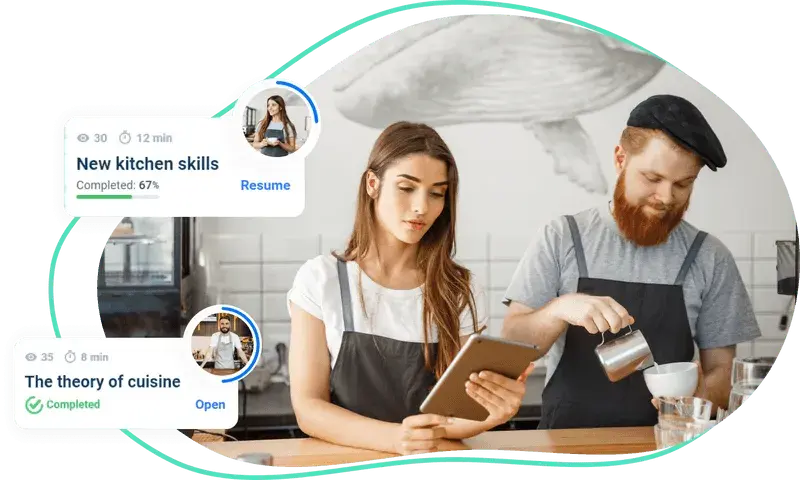 Workers in a coffee shop look at learning courses to improve knowledge right during work
